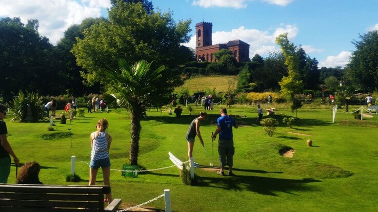 golfing with scenic castle backdrop