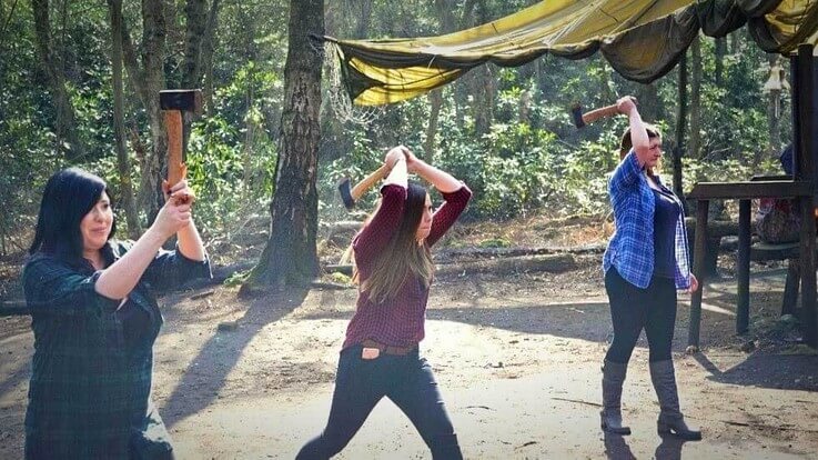 group of ladies on axe throwing range