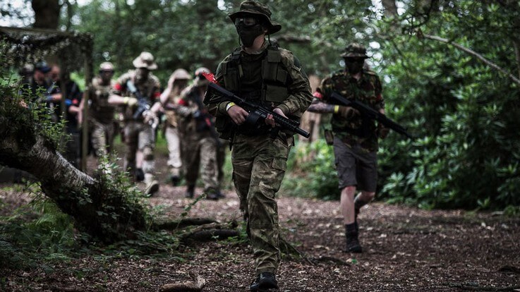 group of walk on airsoft players leaving start point