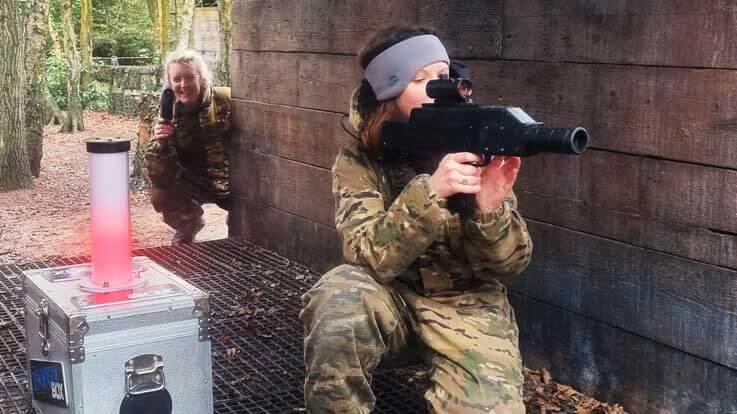 ladies defending the base with laser tag guns