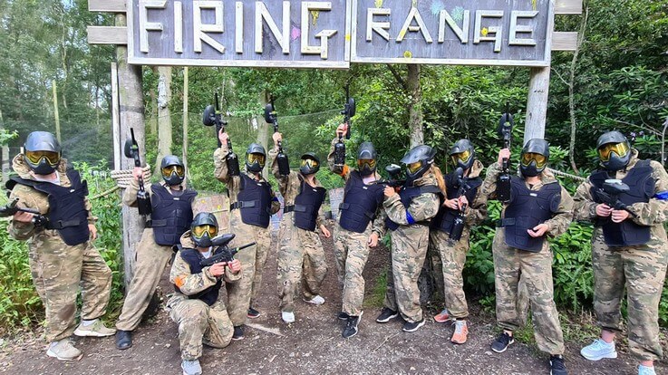 low impact paintball group by firing range sign