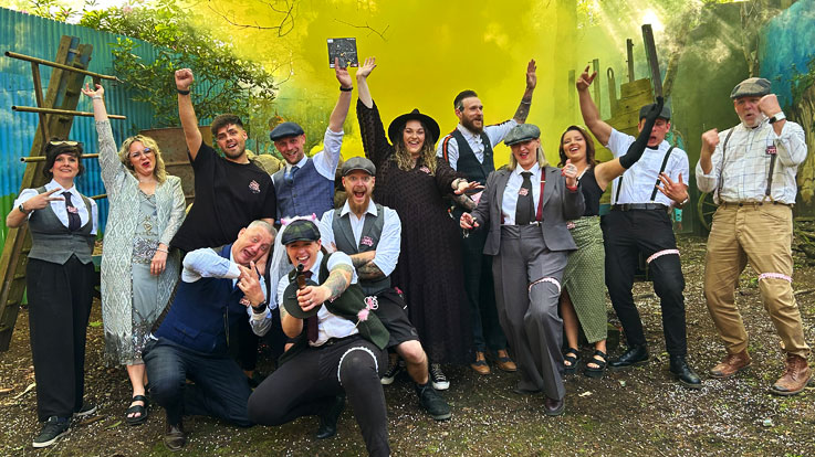 mixed group celebrating on pistol range