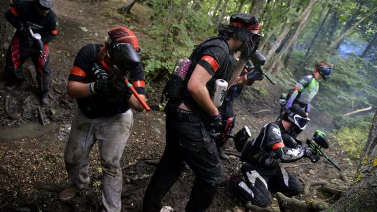 paintballing in woodland