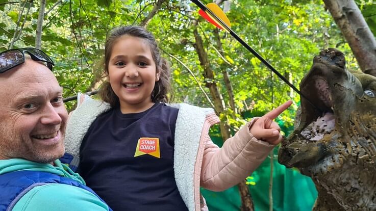 parent and-daughter celebrate direct hit on target