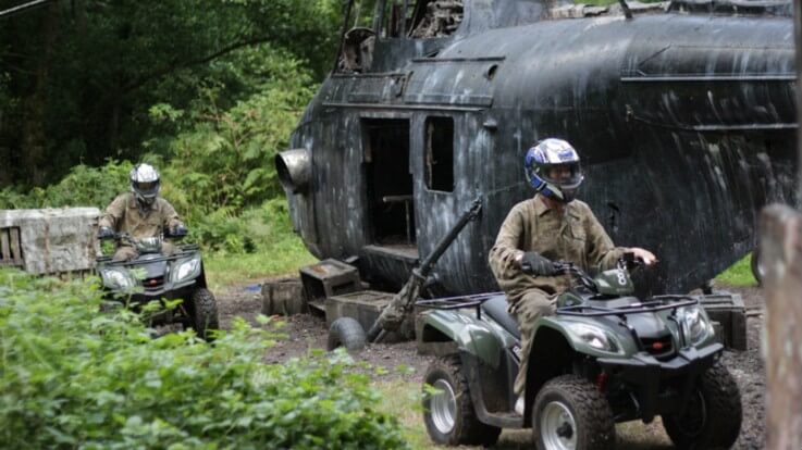 quad bikes riding around helicopter