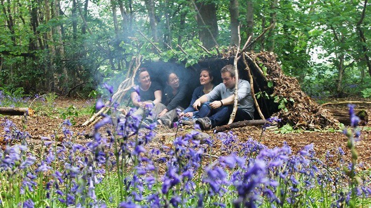 relaxing in bushcraft shelter