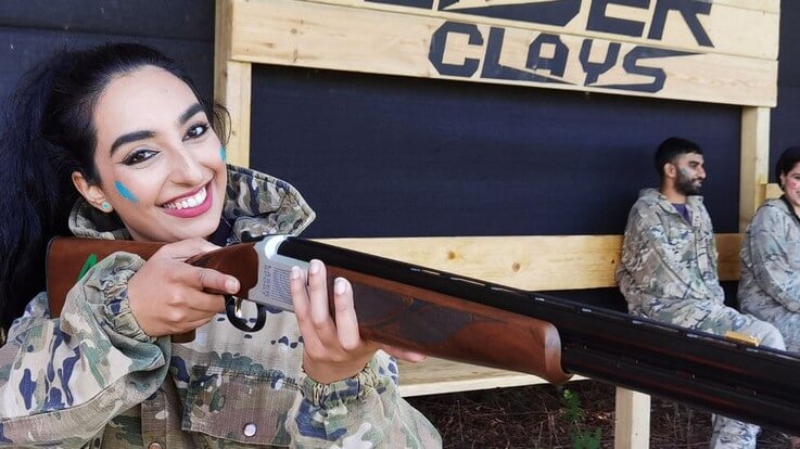 smiling hen party member with-shotgun