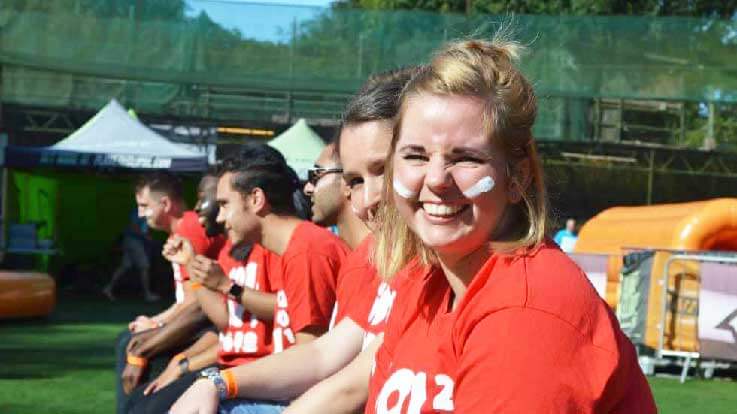 smiling player sitting on inflatable