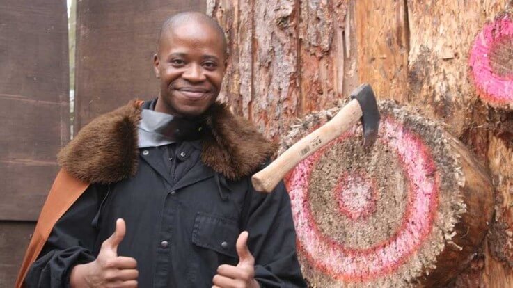 thumbs up with axe throwing target