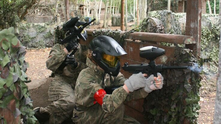 two low impact paintballers take cover